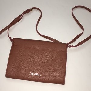 brown crossbody bag, with multiple pockets.